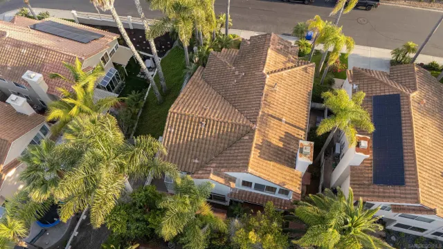 a view of a house with a flower garden