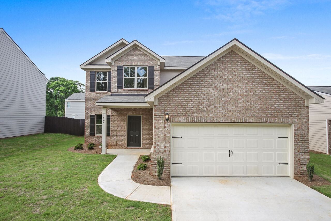 200 Tyndall Way, Unit 80PATRIOT Perry, GA 31069 - Photo 1 of 1 a front view of a house with garden