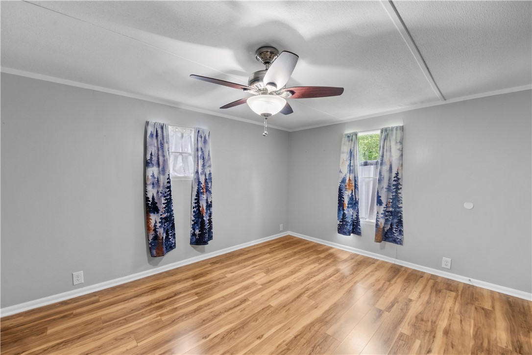 169 West Bagwell Road Liberty, SC 29657 - Photo 26 of 29 Well-appointed bedroom featuring attractive wood-look flooring and a functional ceiling fan.