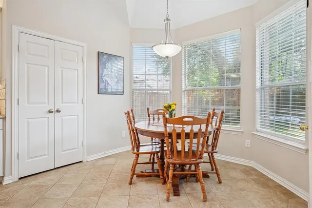 a view of a dining room with furniture window and outside view