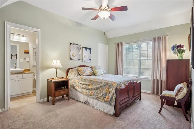 a bedroom with a bed chair and window