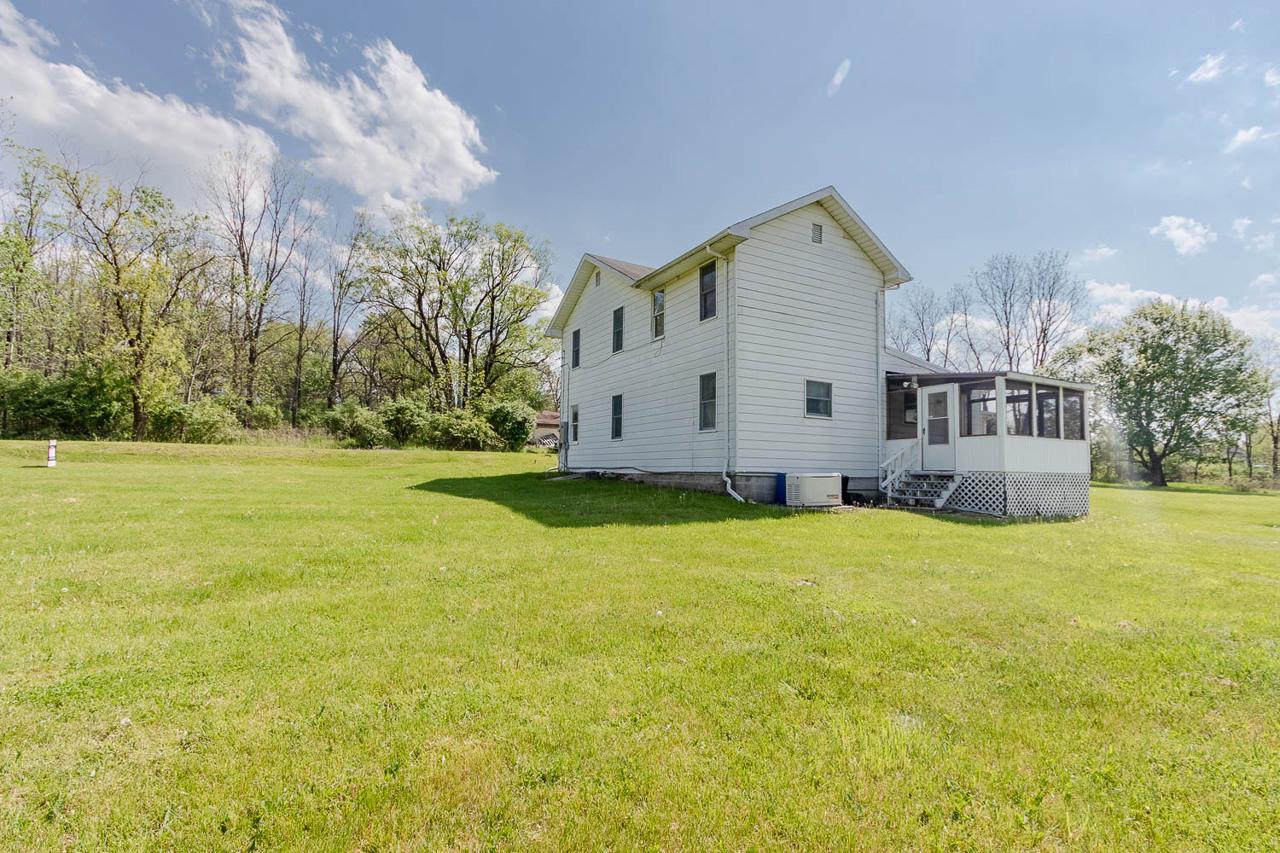 203 Gorton Road Moshannon, PA 16859 - Photo 36 of 39 a view of a house with a yard and garage