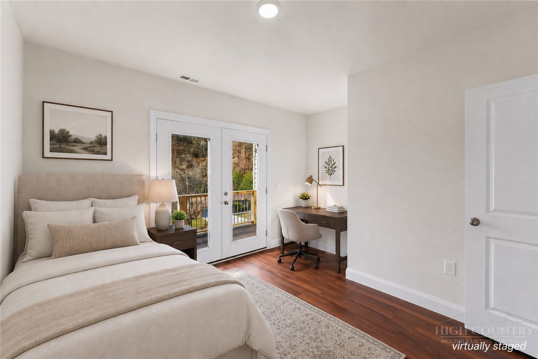 262 Old Bristol Road Boone, NC 28607 - Photo 13 of 26 a bedroom with a bed and wooden floor