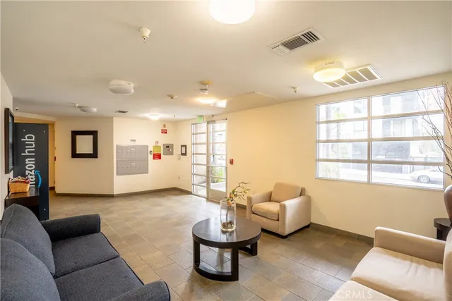 a living room with furniture and a large window