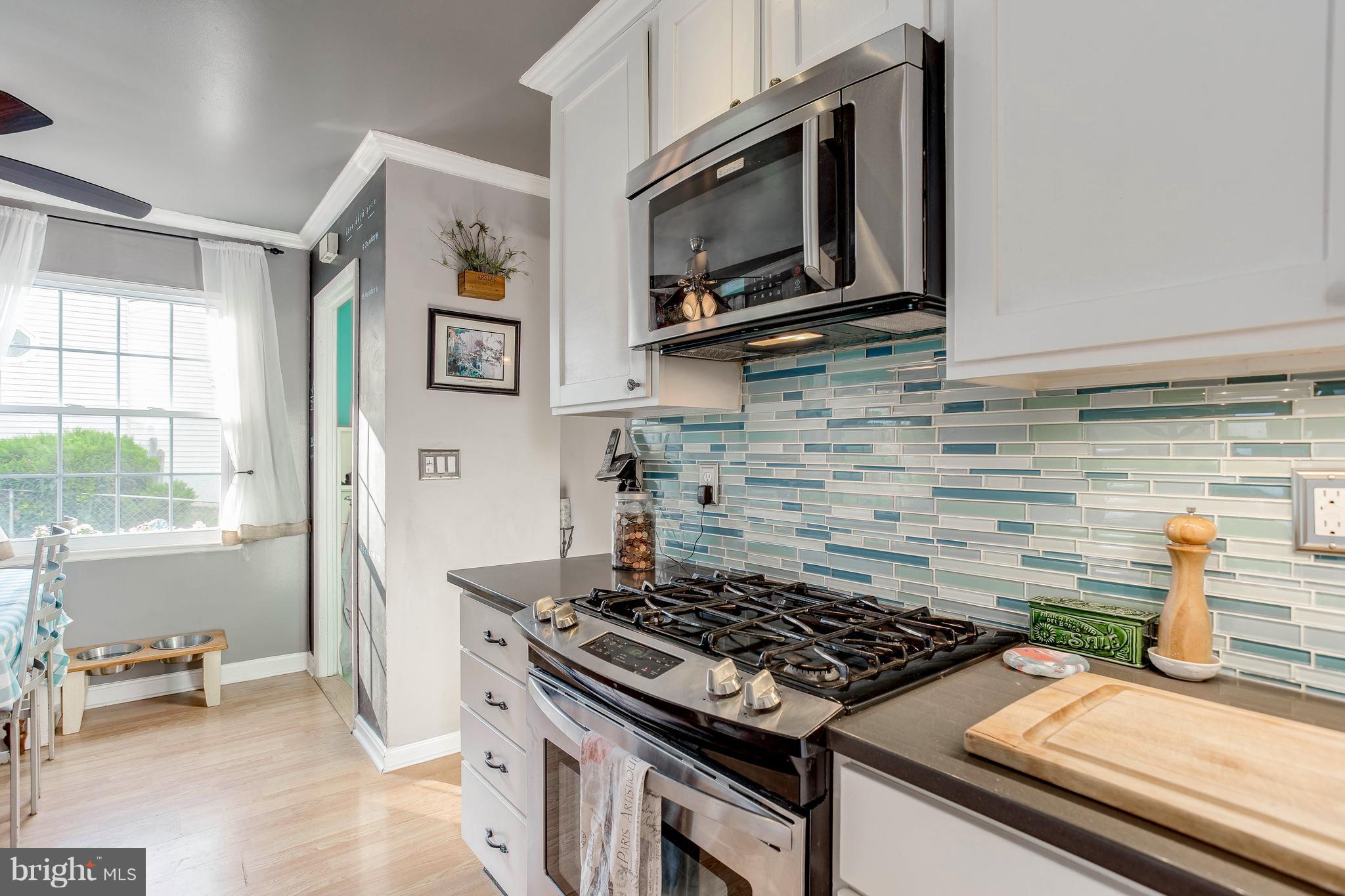 4313 Slater Avenue Baltimore, MD 21236 - Photo 12 of 29 a kitchen with a stove and a microwave