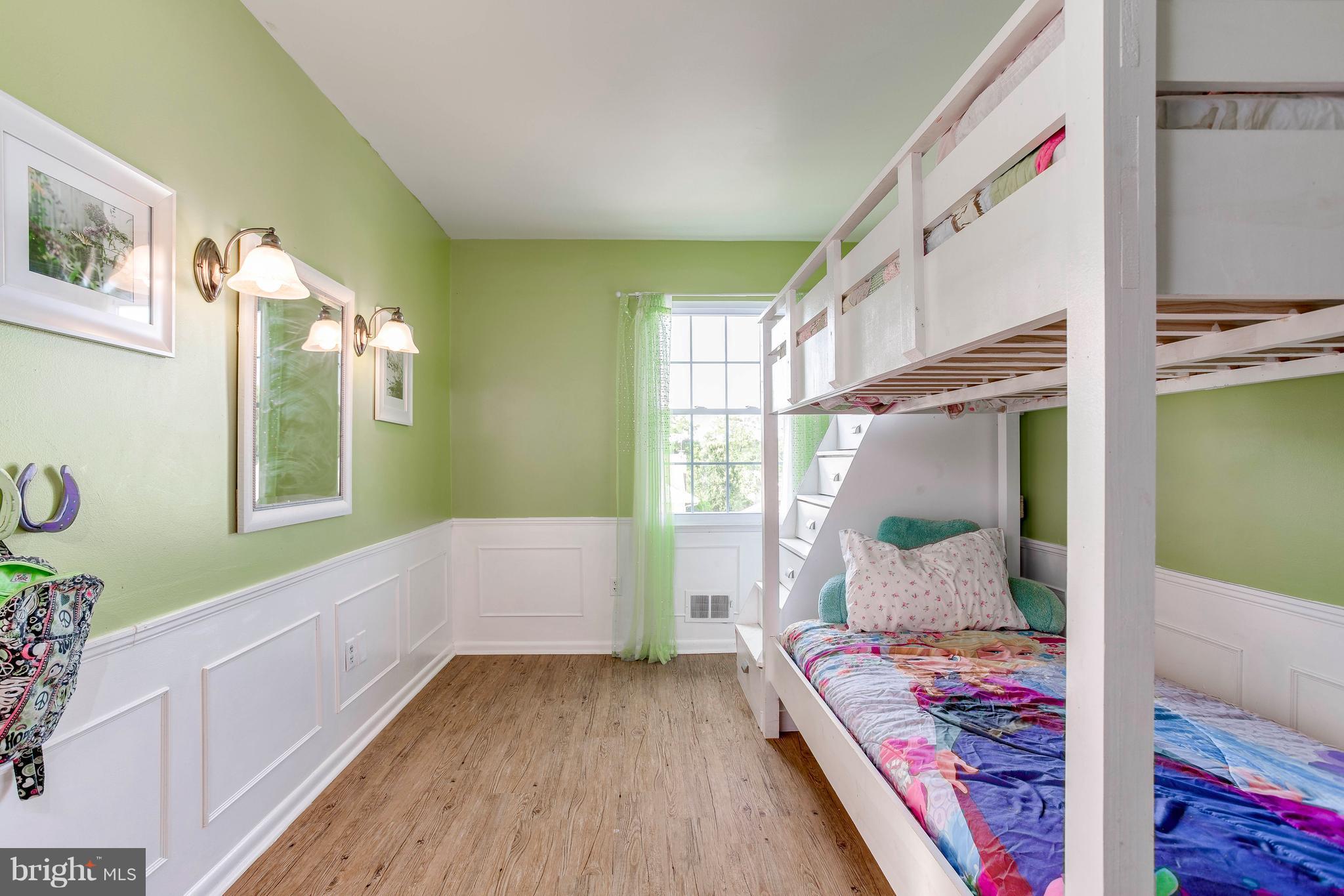 4313 Slater Avenue Baltimore, MD 21236 - Photo 21 of 29 a bedroom with a bed and a window