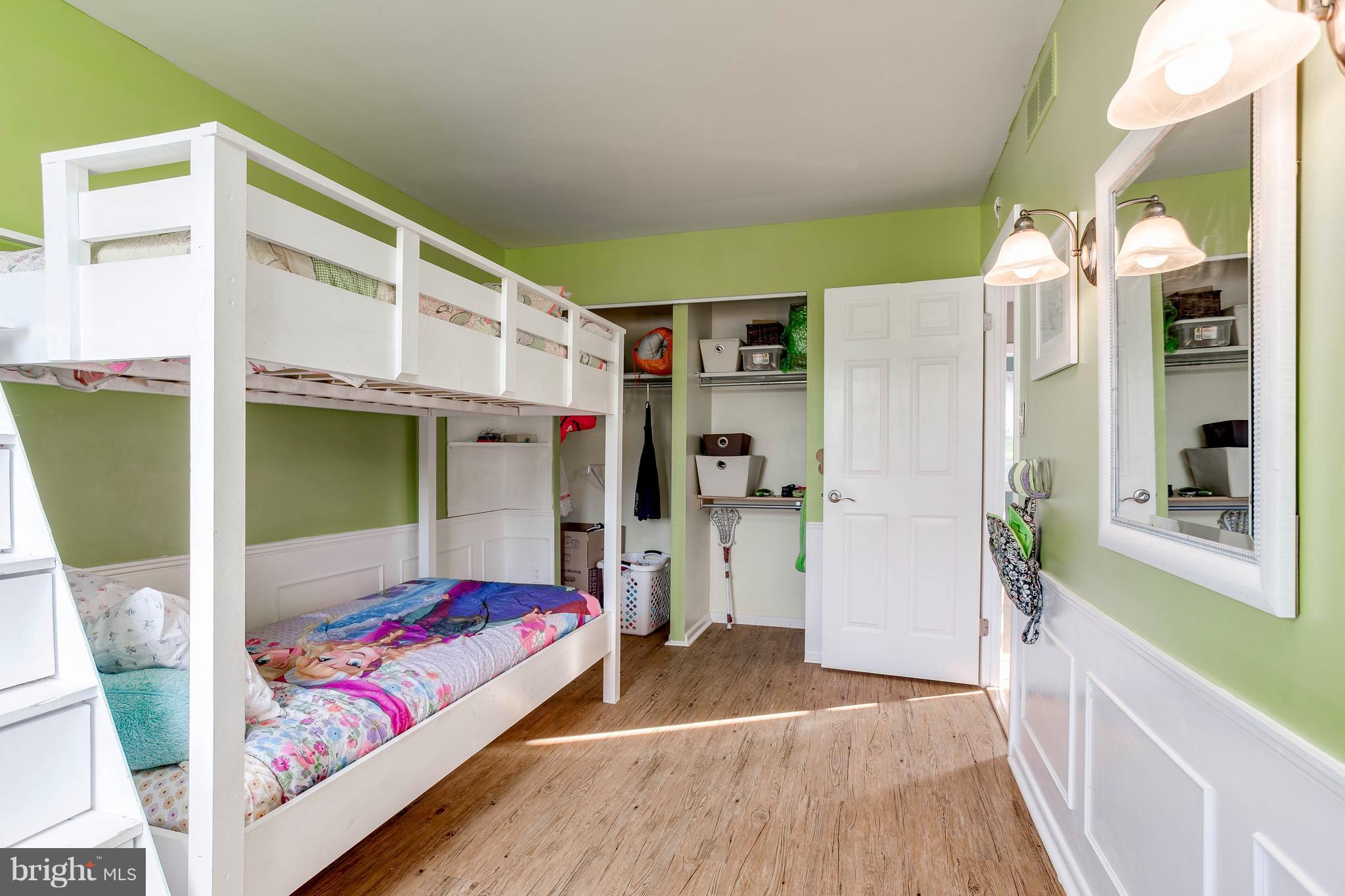 4313 Slater Avenue Baltimore, MD 21236 - Photo 22 of 29 a bedroom with a bed and a large window