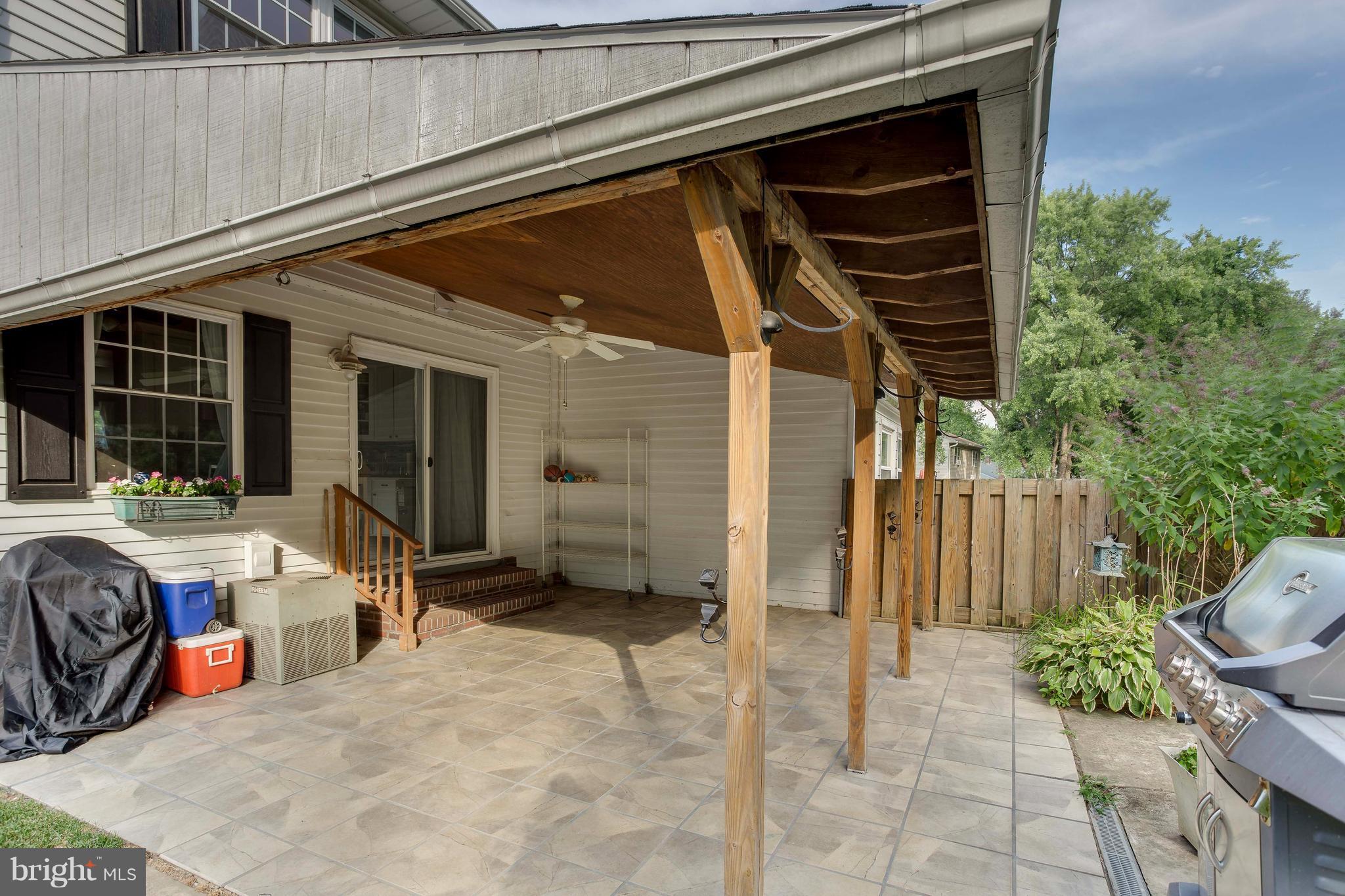 4313 Slater Avenue Baltimore, MD 21236 - Photo 27 of 29 a view of a chair and tables in the patio