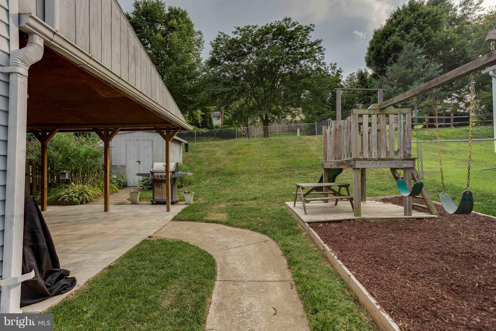 4313 Slater Avenue Baltimore, MD 21236 - Photo 28 of 29 a view of a backyard with sitting area