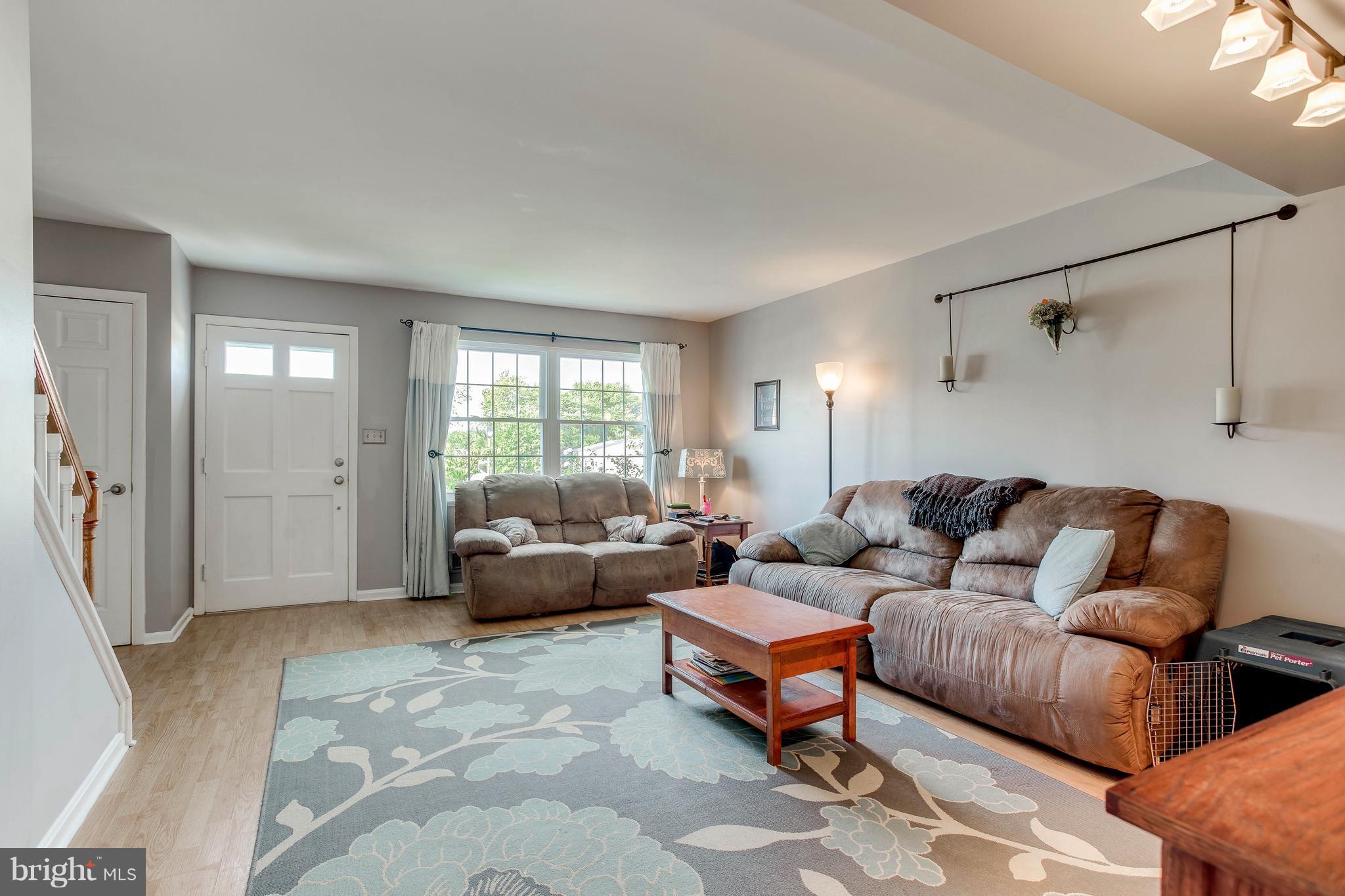 4313 Slater Avenue Baltimore, MD 21236 - Photo 5 of 29 a living room with furniture and a large window