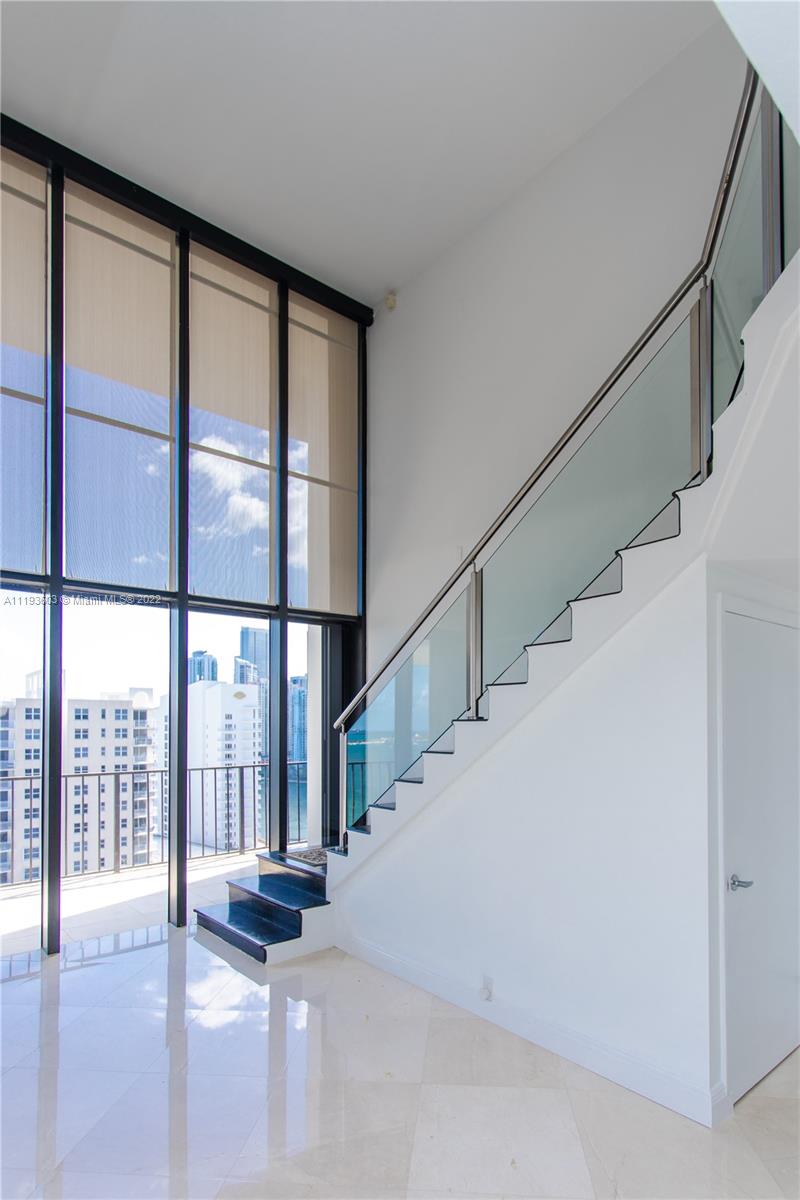 520 Brickell Key Drive, Unit PH03 Miami, FL 33131 - Photo 19 of 75 a view of an entryway with stairs