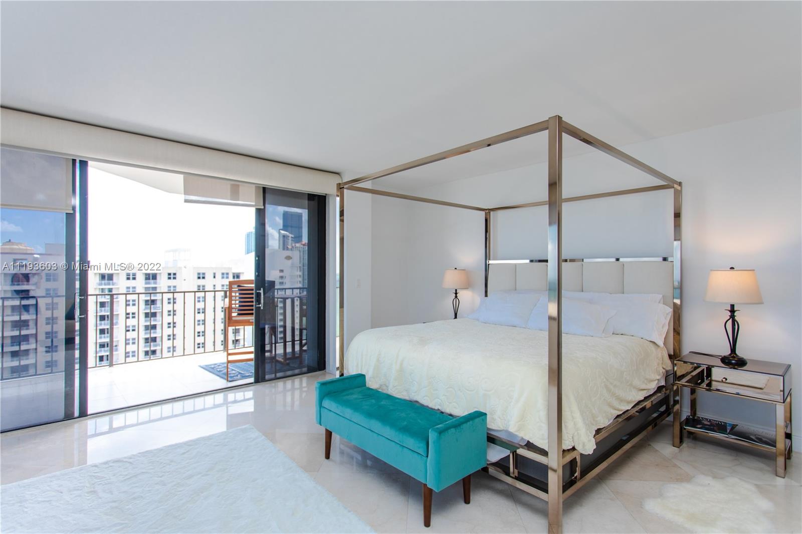 520 Brickell Key Drive, Unit PH03 Miami, FL 33131 - Photo 36 of 75 a bedroom with a bed and large window