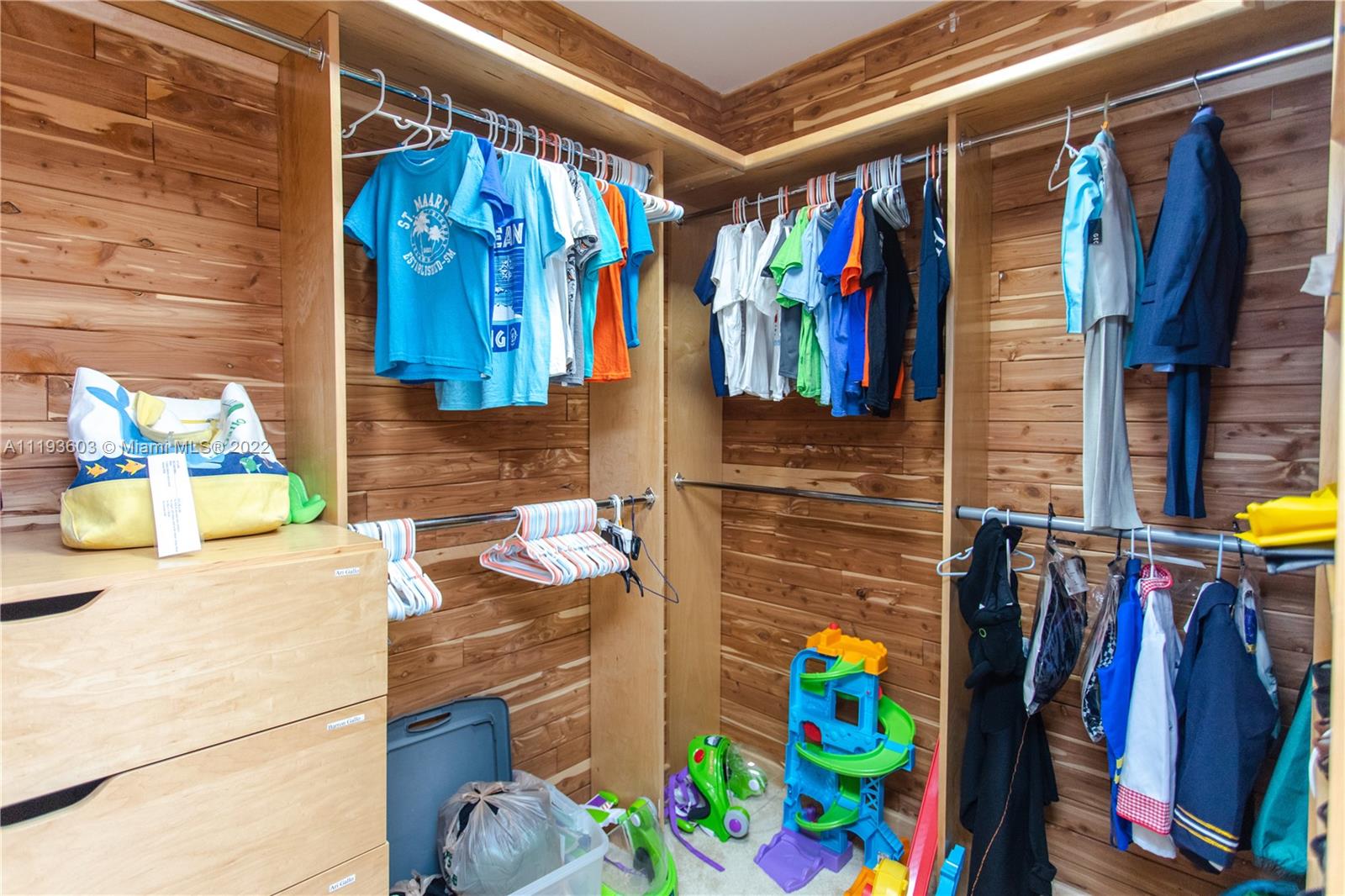 520 Brickell Key Drive, Unit PH03 Miami, FL 33131 - Photo 61 of 75 a view of walk in closet with clothes and shoes