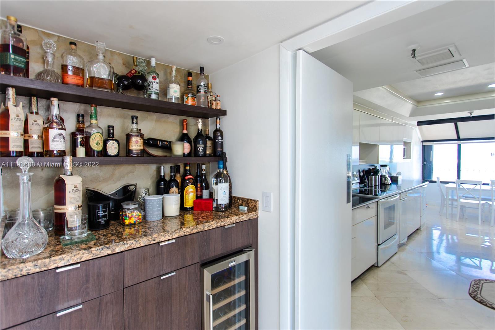 520 Brickell Key Drive, Unit PH03 Miami, FL 33131 - Photo 63 of 75 a kitchen with stainless steel appliances granite countertop a sink and cabinets