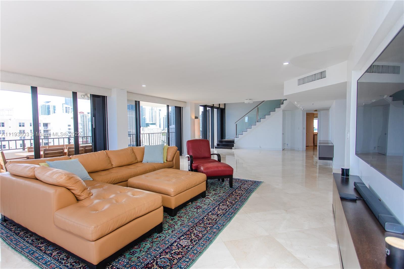 520 Brickell Key Drive, Unit PH03 Miami, FL 33131 - Photo 7 of 75 a living room with furniture and a large window