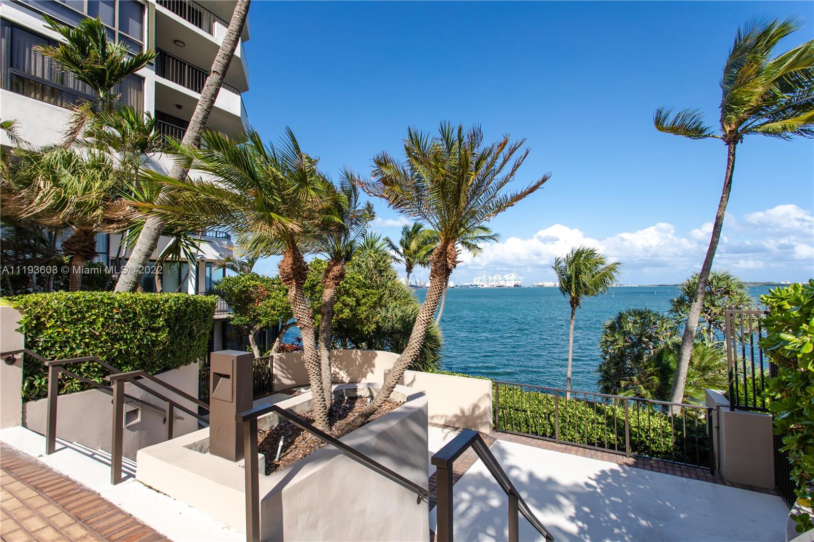 520 Brickell Key Drive, Unit PH03 Miami, FL 33131 - Photo 72 of 75 a view of backyard with outdoor seating and plants