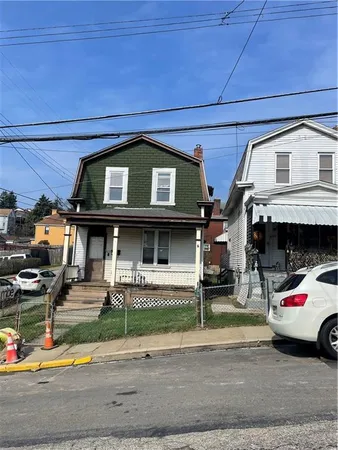 a view of a building with car parked
