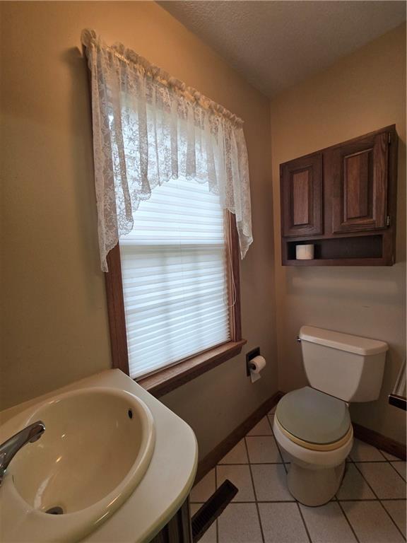 205 Hamburg Road Greenville, PA 16125 - Photo 18 of 39 a bathroom with a toilet a sink and mirror