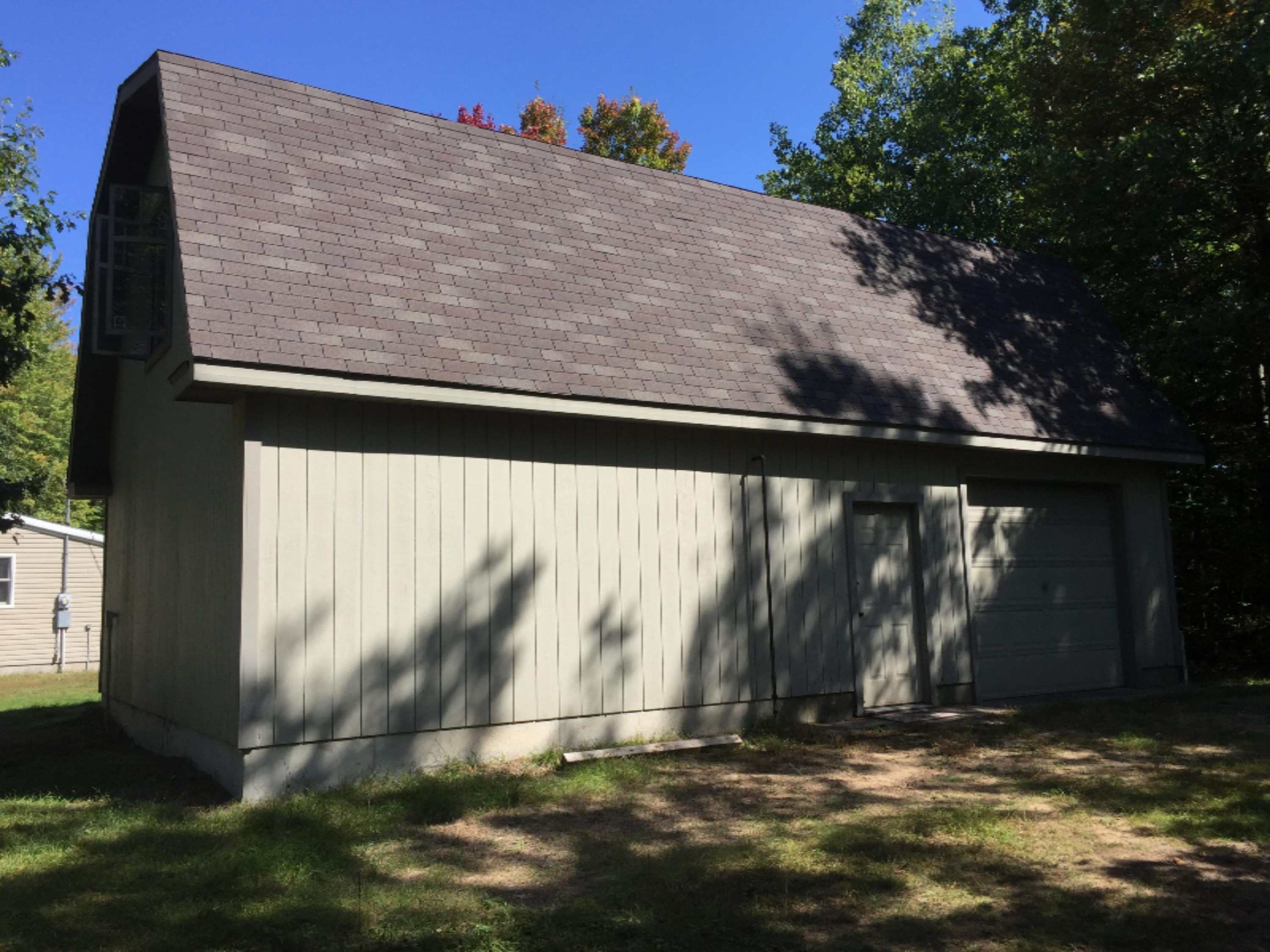 7040 North High Bridge Road Kaleva, MI 49645 - Photo 11 of 50 Overhead Door and Main Door off Back
