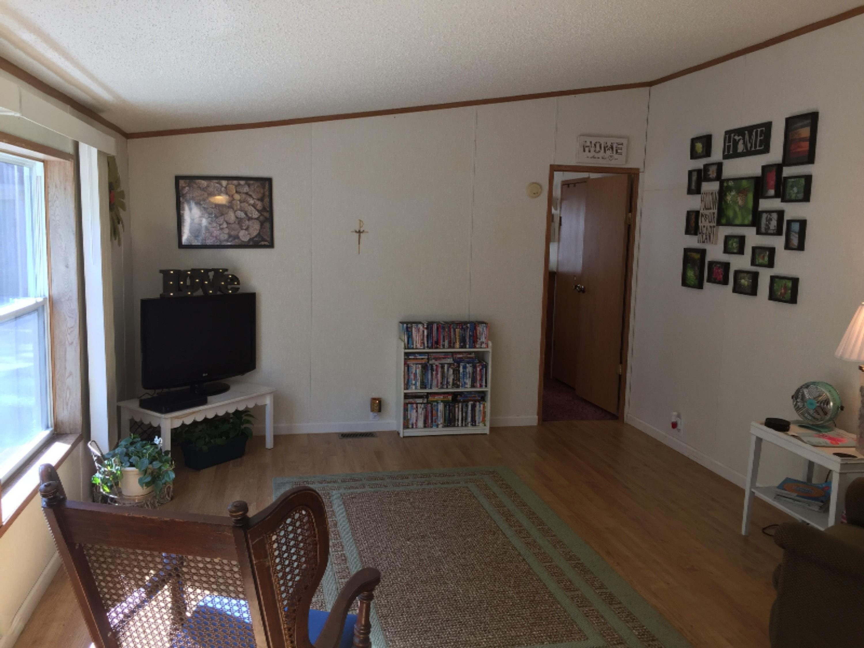 7040 North High Bridge Road Kaleva, MI 49645 - Photo 27 of 50 Living Room into Master Bedroom