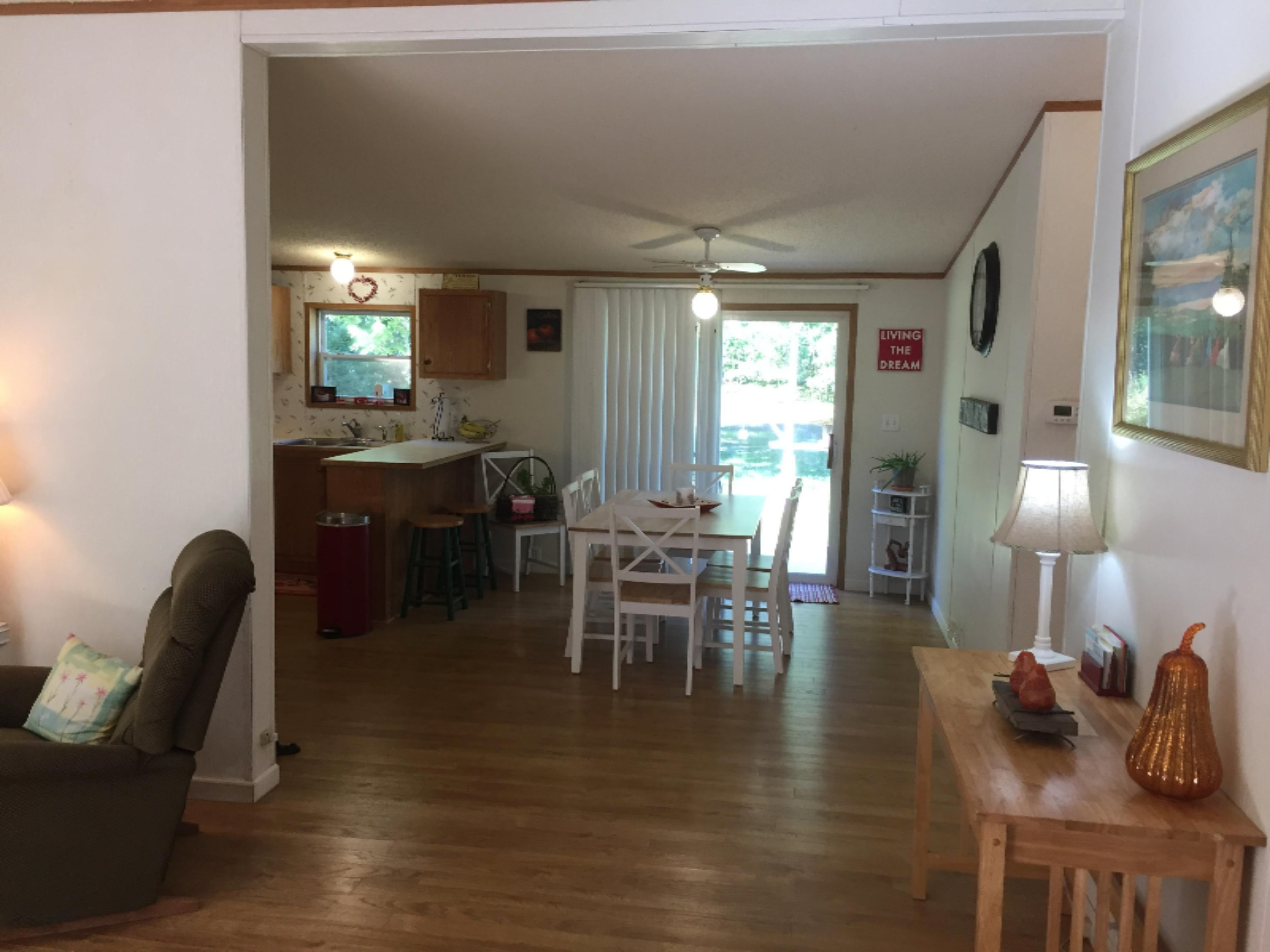 7040 North High Bridge Road Kaleva, MI 49645 - Photo 29 of 50 Dining Room with Sliding Glass Door