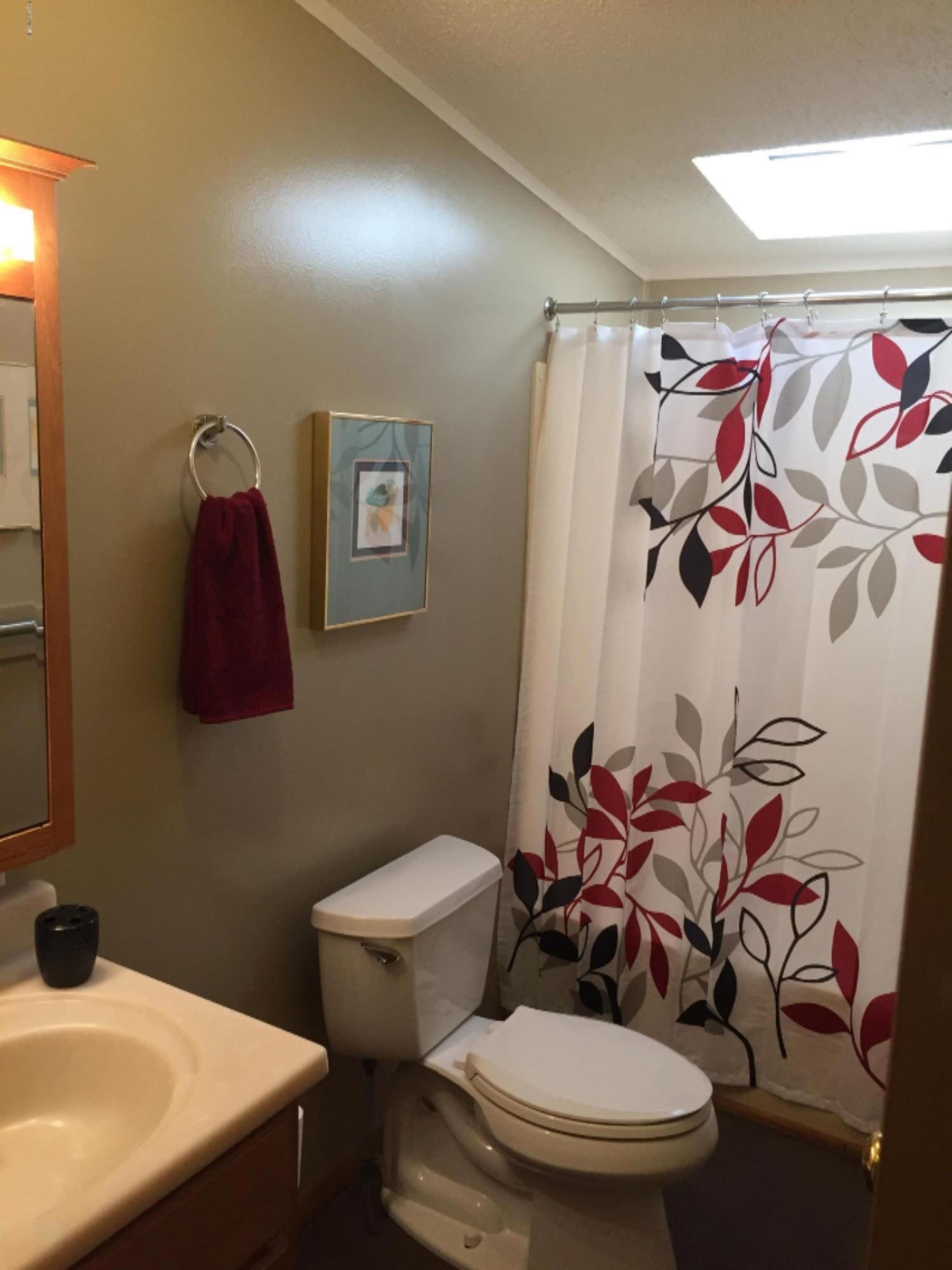 7040 North High Bridge Road Kaleva, MI 49645 - Photo 46 of 50 Hall Bathroom with shower and tub