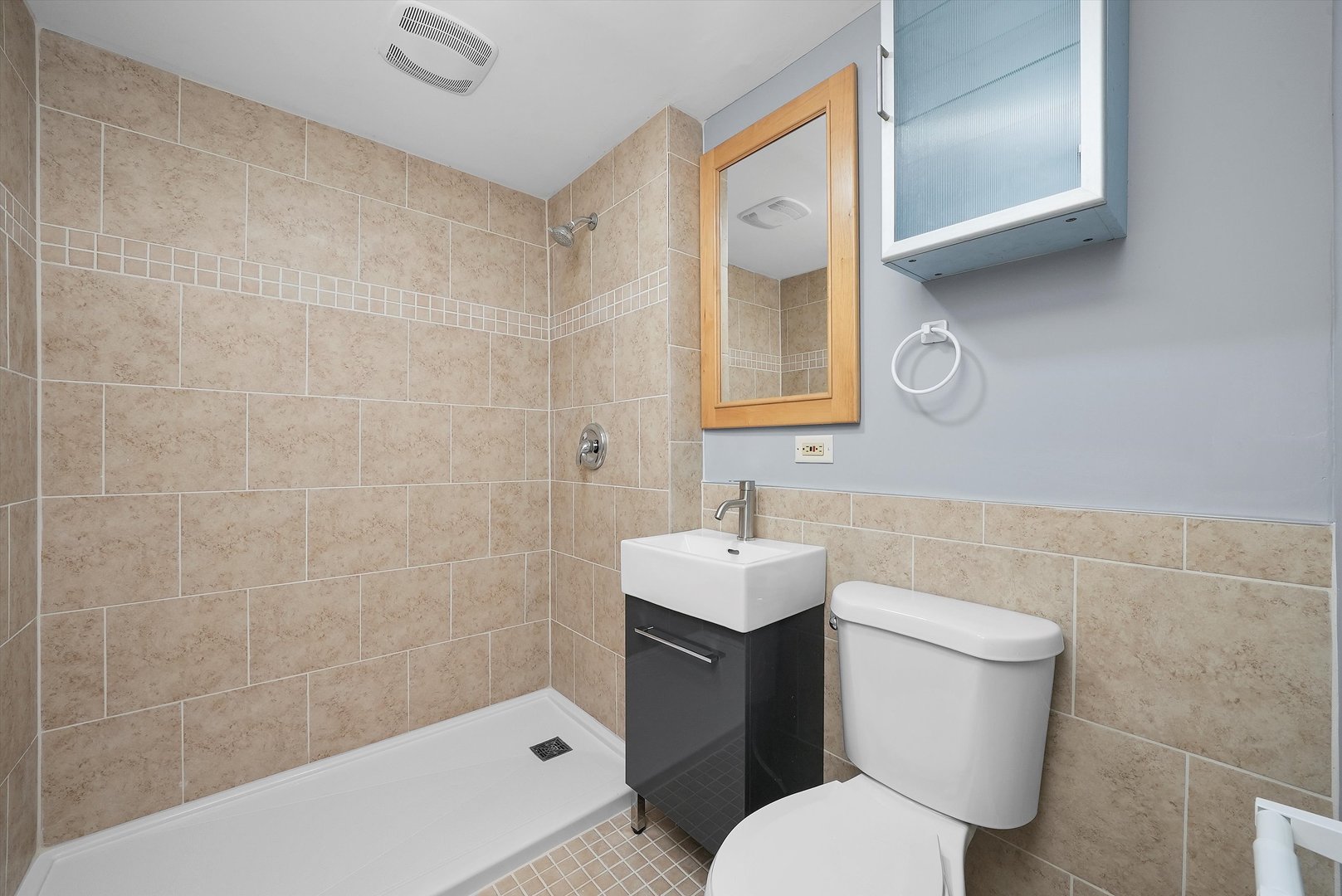 224 South State Street Lockport, IL 60441 - Photo 7 of 28 a bathroom with a toilet sink and mirror