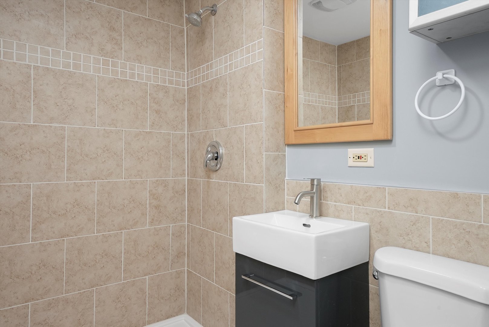 224 South State Street Lockport, IL 60441 - Photo 8 of 28 a bathroom with a sink toilet and a mirror