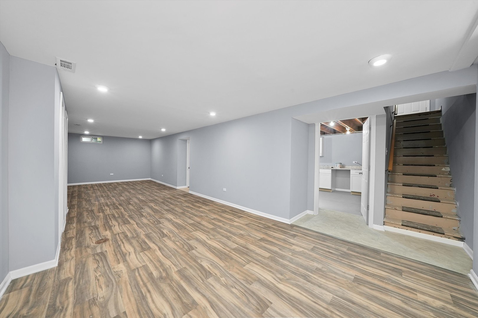 224 South State Street Lockport, IL 60441 - Photo 9 of 28 a view of empty room with wooden floor and window