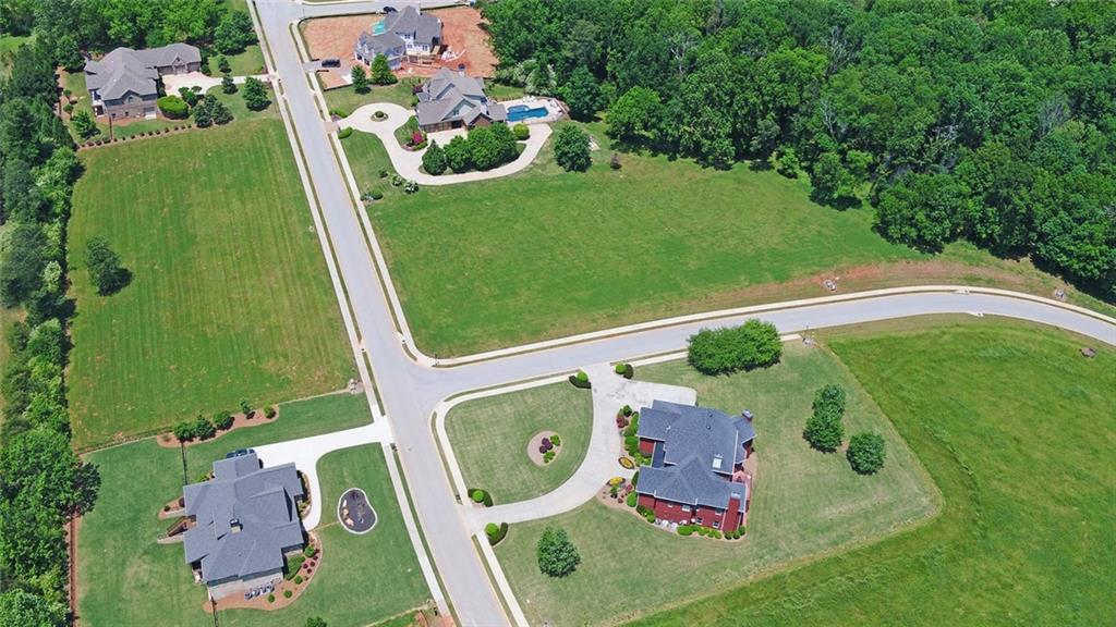 5325 Retreat Drive Flowery Branch, GA 30542 - Photo 1 of 7 an aerial view of a golf course with swimming pool
