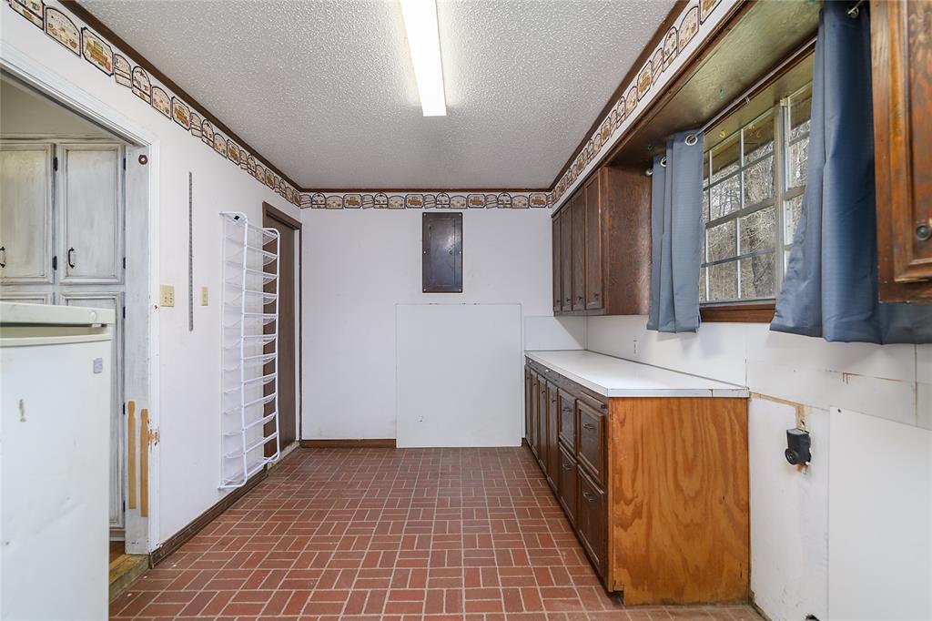231 Grant Circle Doyline, LA 71023 - Photo 21 of 24 Large, Spacious Laundry Room with Built In Cabinets and Room for Extra Freezer & Refrigerator