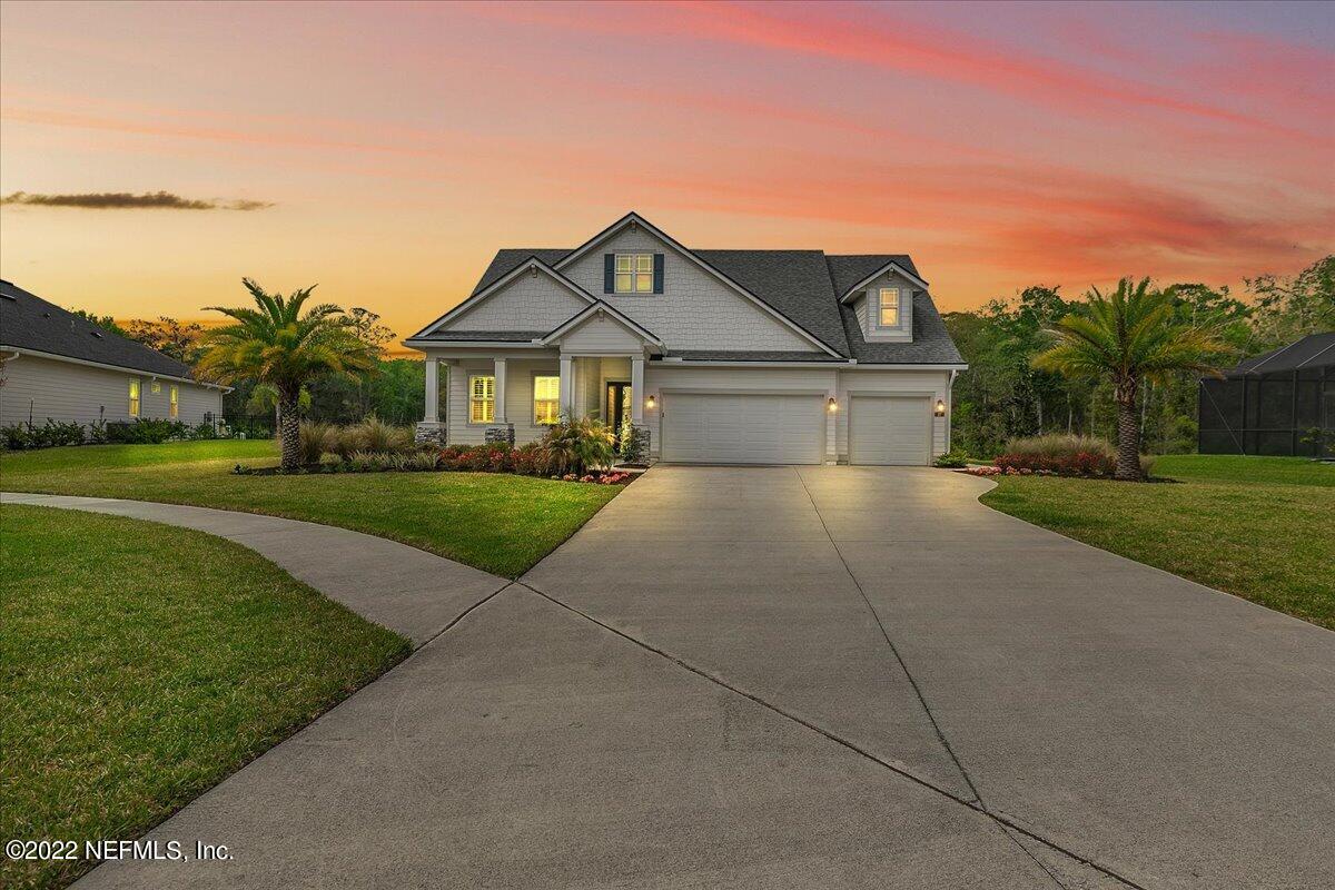 27 Red Twig Way St. Augustine, FL 32092 - Photo 1 of 47 a front view of a house with a yard and garage