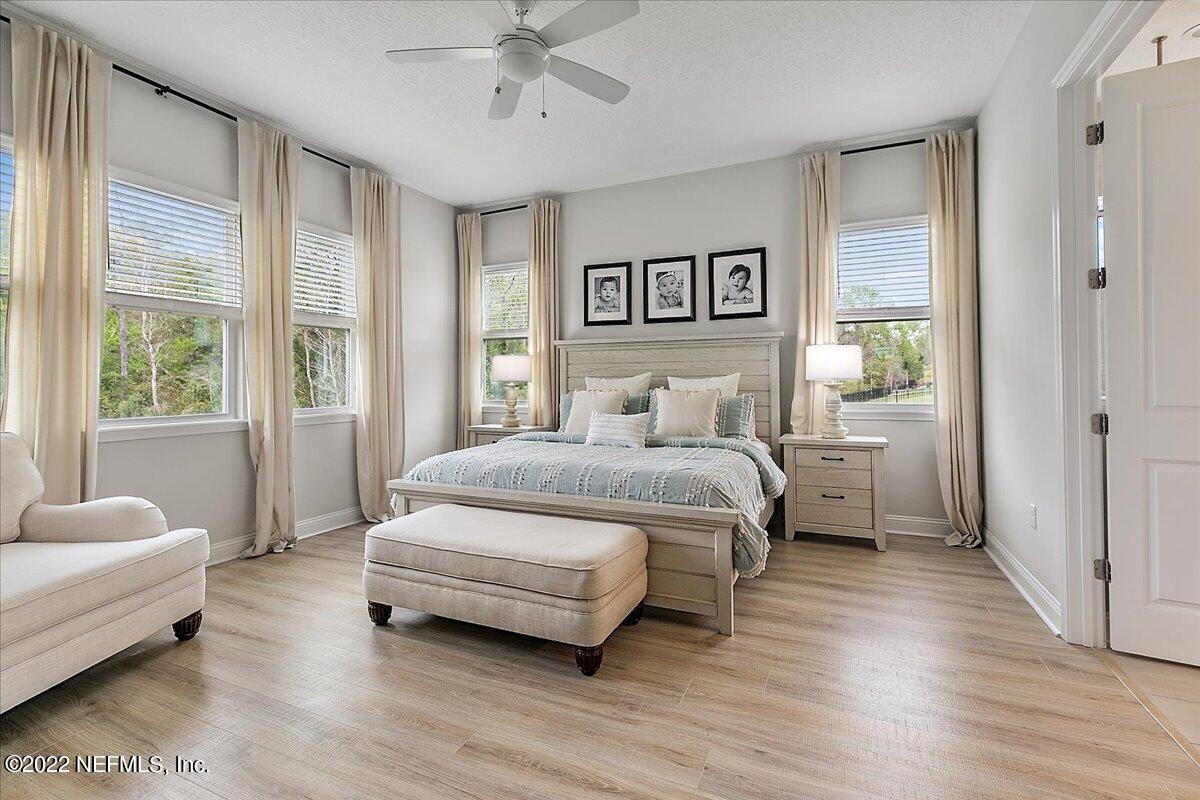 27 Red Twig Way St. Augustine, FL 32092 - Photo 13 of 47 a bedroom with a bed and glass window