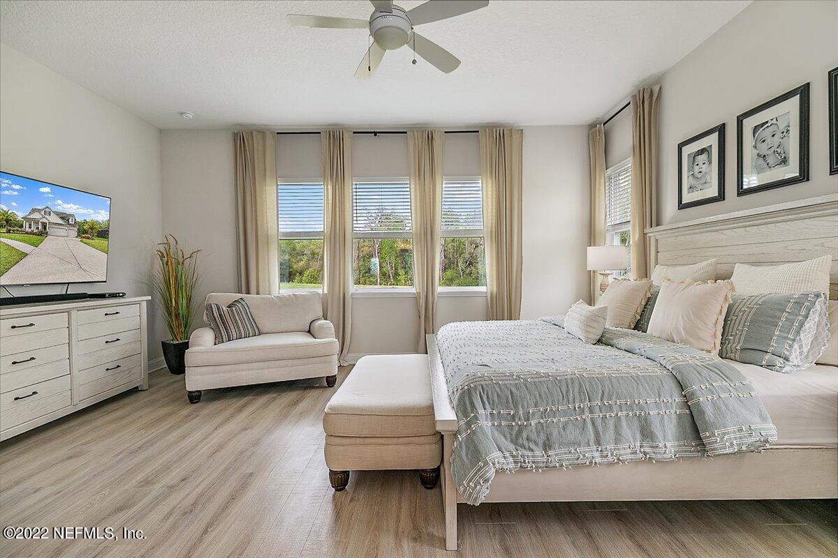 27 Red Twig Way St. Augustine, FL 32092 - Photo 15 of 47 a bedroom with a bed and a couch