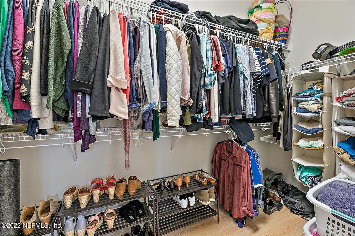 27 Red Twig Way St. Augustine, FL 32092 - Photo 18 of 47 a view of walk in closet with clothes and shoes