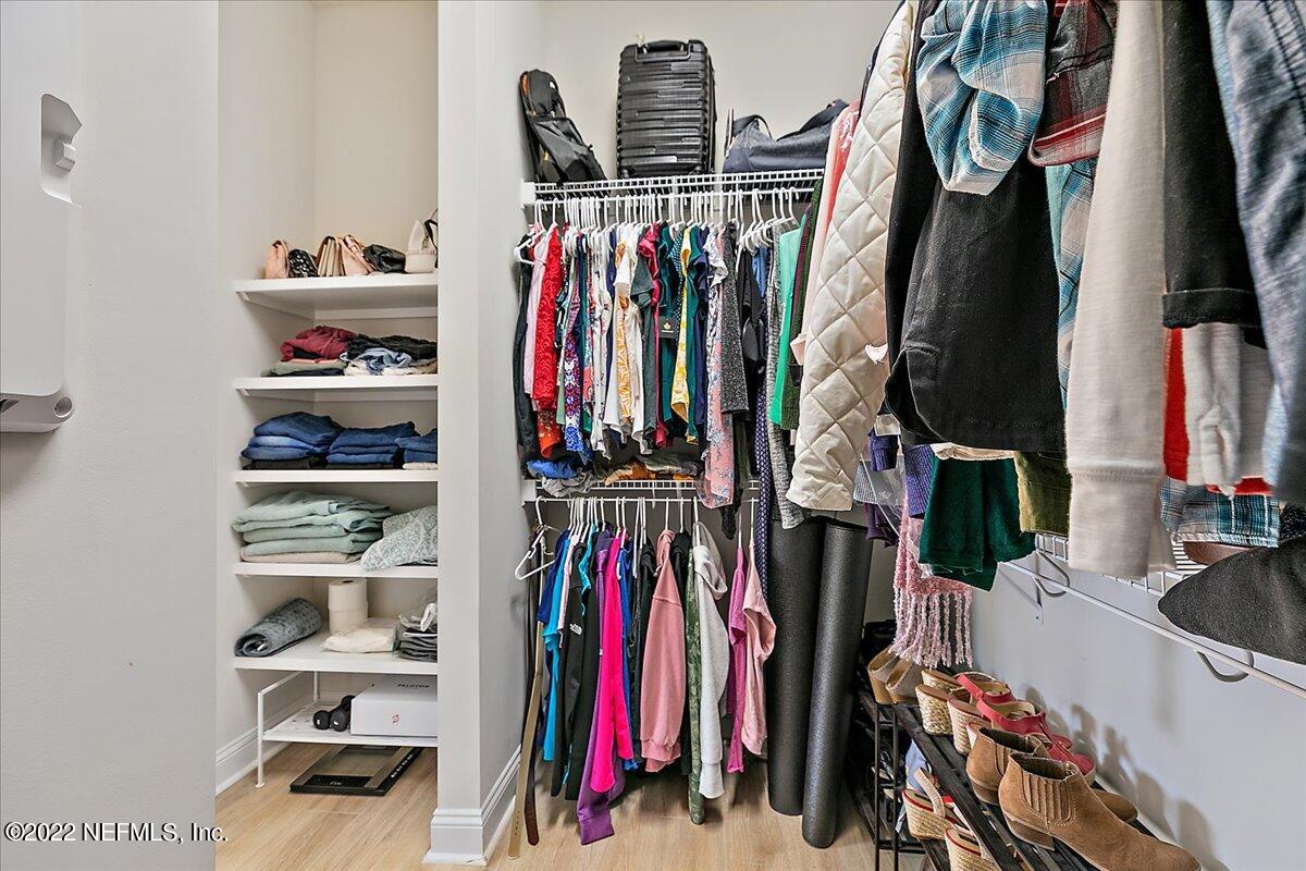 27 Red Twig Way St. Augustine, FL 32092 - Photo 19 of 47 a view of walk in closet with clothes and shoes
