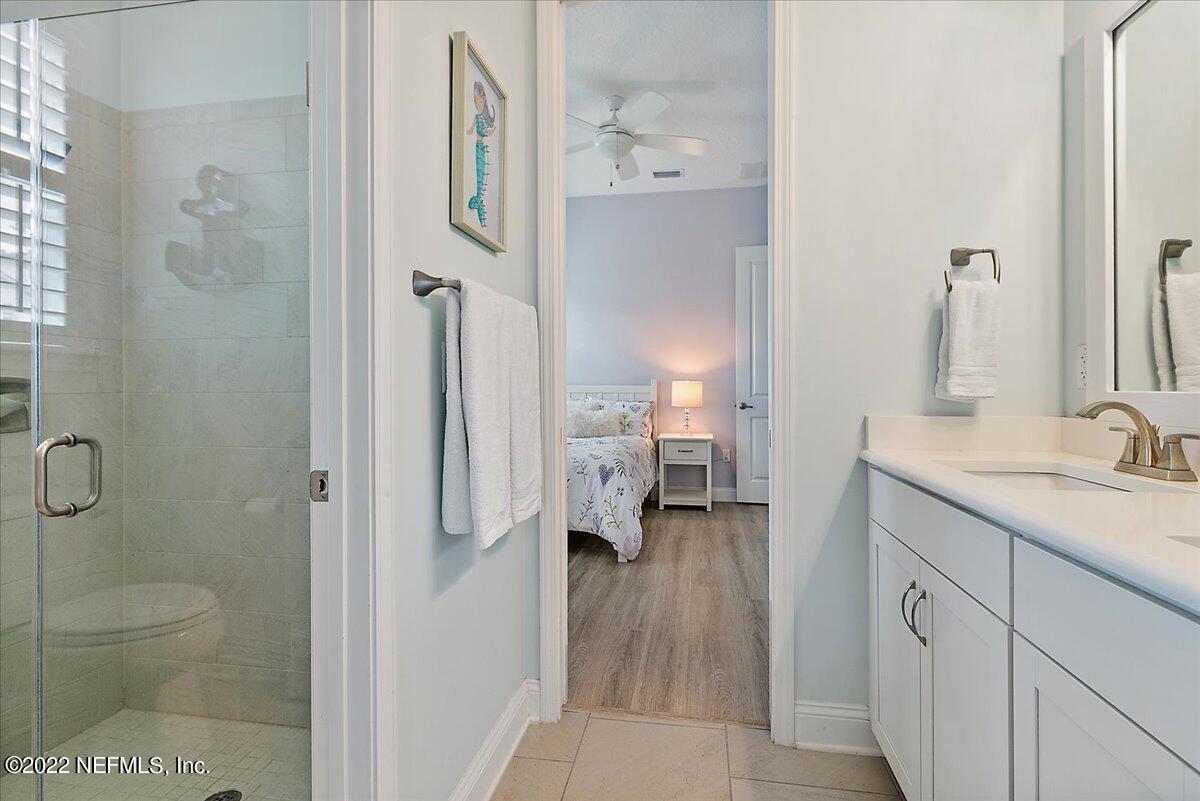 27 Red Twig Way St. Augustine, FL 32092 - Photo 21 of 47 a spacious bathroom with a granite countertop sink a toilet and a shower