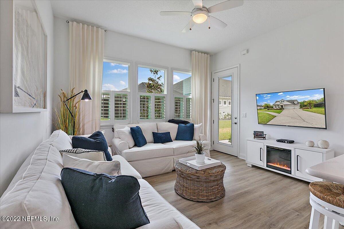 27 Red Twig Way St. Augustine, FL 32092 - Photo 27 of 47 a living room with fireplace furniture and a flat screen tv