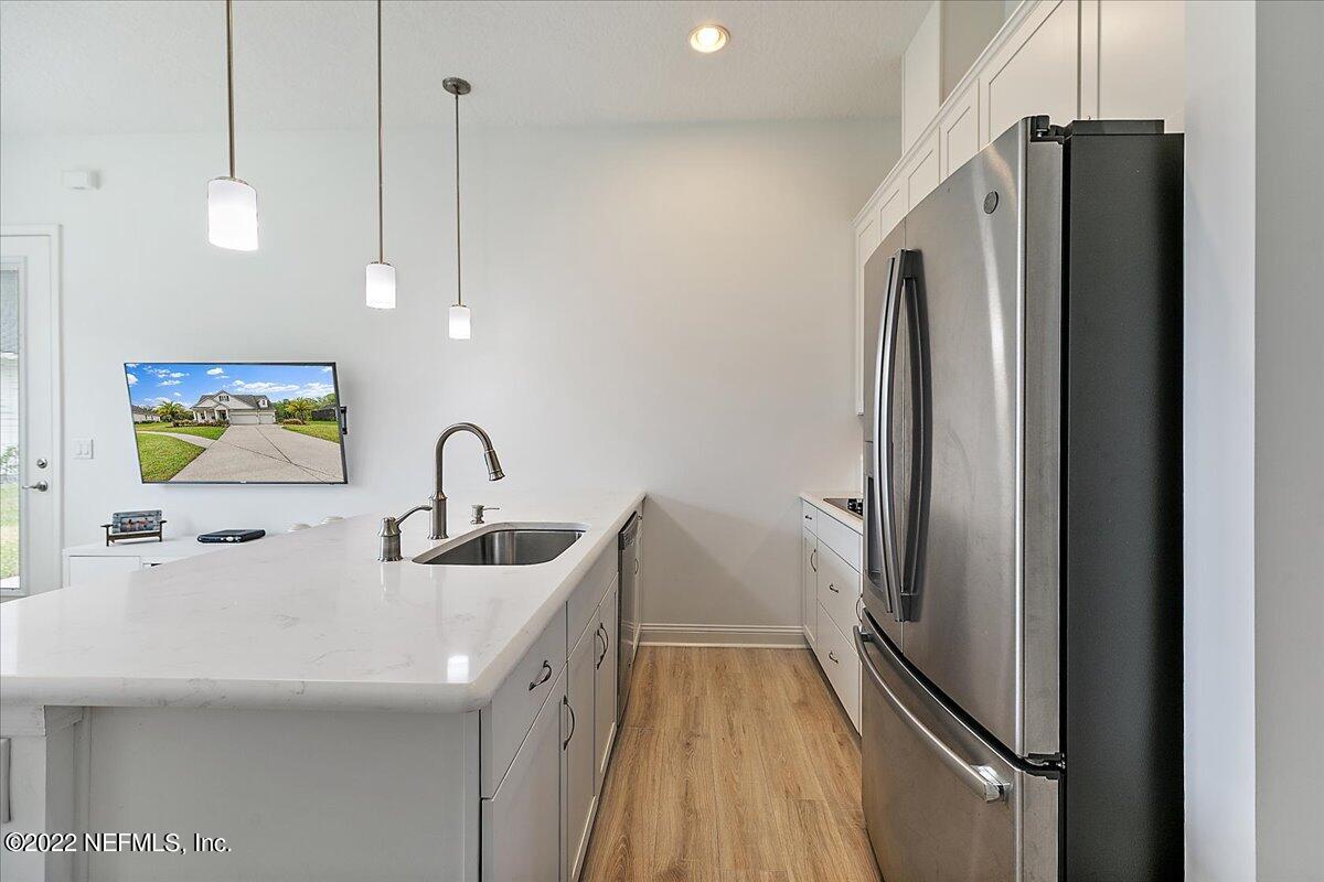 27 Red Twig Way St. Augustine, FL 32092 - Photo 29 of 47 a kitchen with stainless steel appliances a refrigerator and a sink