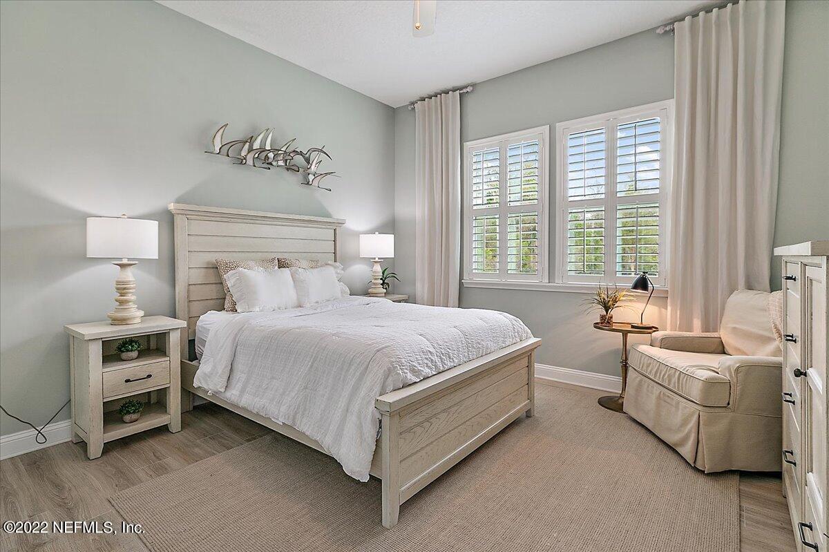 27 Red Twig Way St. Augustine, FL 32092 - Photo 30 of 47 a spacious bedroom with a bed and a couch