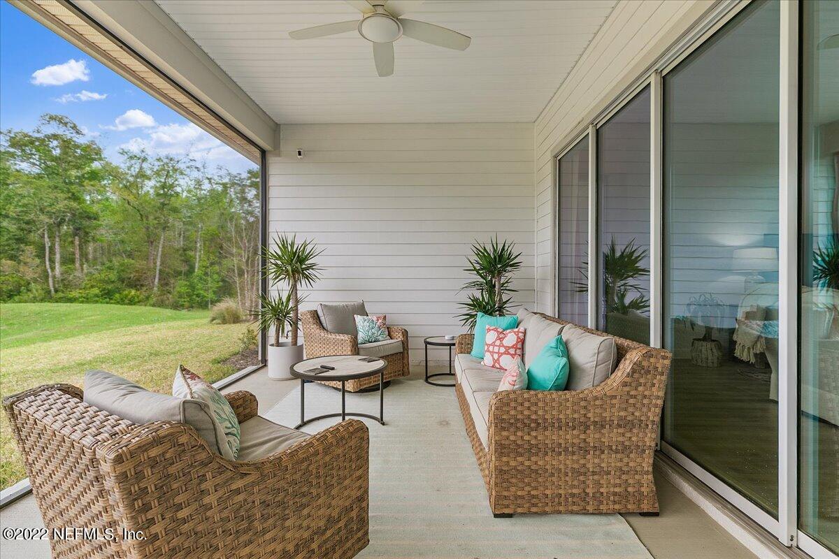 27 Red Twig Way St. Augustine, FL 32092 - Photo 33 of 47 a outdoor space with patio the couches and a dining table with garden view