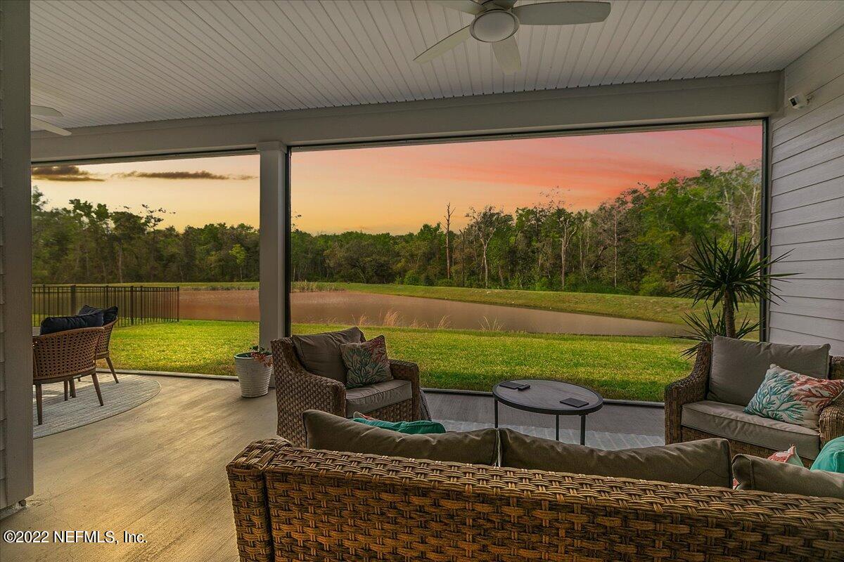 27 Red Twig Way St. Augustine, FL 32092 - Photo 35 of 47 a balcony with furniture and a garden view