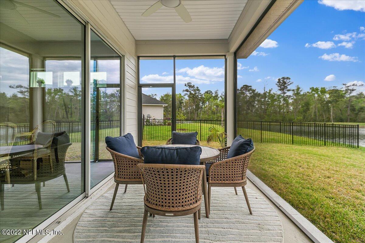 27 Red Twig Way St. Augustine, FL 32092 - Photo 36 of 47 a view of a balcony with lake and a wooden floor