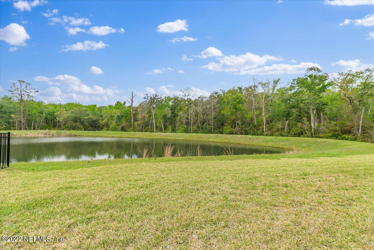 27 Red Twig Way St. Augustine, FL 32092 - Photo 37 of 47 a view of a lake with a yard