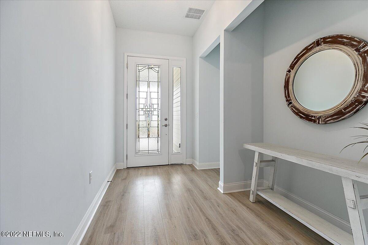 27 Red Twig Way St. Augustine, FL 32092 - Photo 4 of 47 a view of a room with wooden floor and window