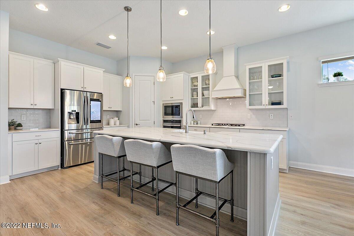 27 Red Twig Way St. Augustine, FL 32092 - Photo 8 of 47 a large kitchen with a table and chairs