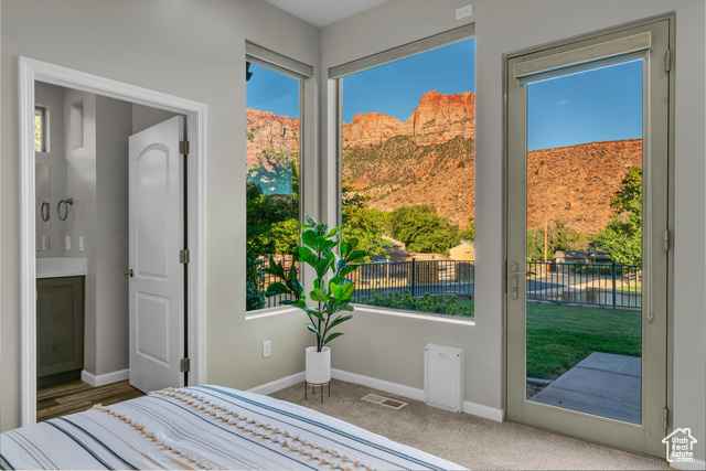 101 Chuckwalla Lane Springdale, UT 84767 - Photo 9 of 51 Carpeted bedroom featuring baseboards and access to outside