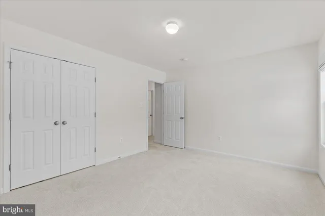 a bathroom with a granite countertop sink a toilet and a tub