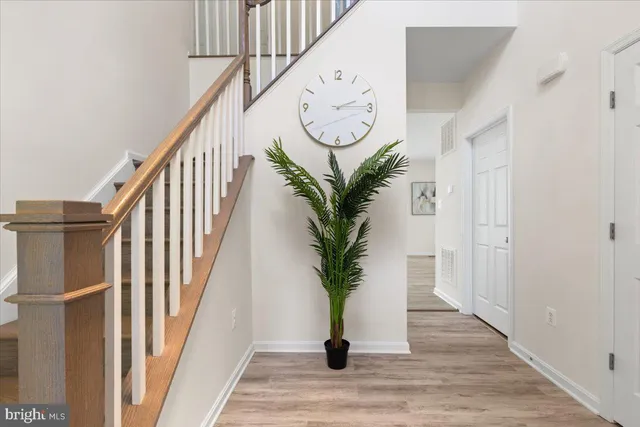 a view of entryway with wooden floor