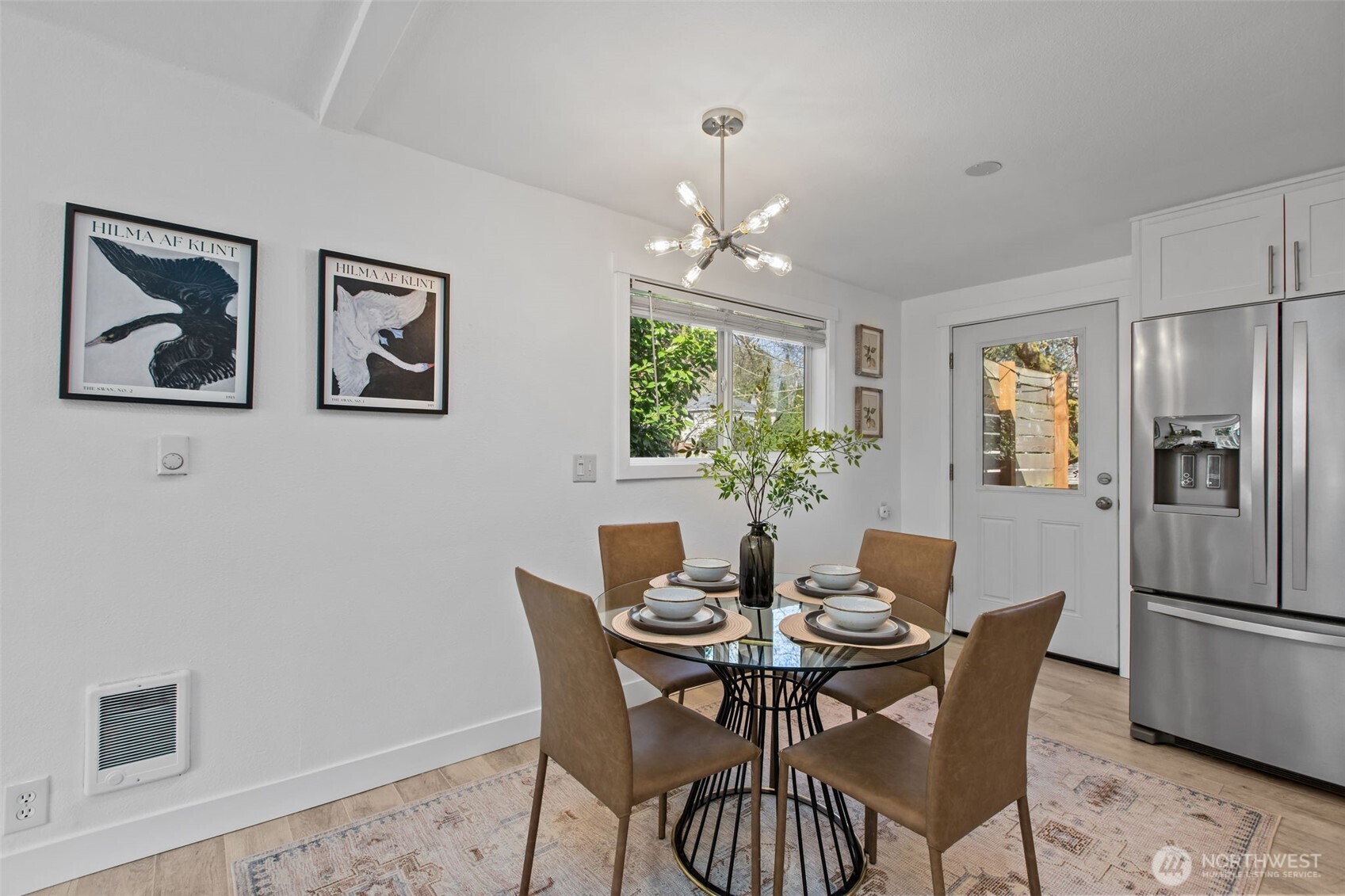 2018 Northeast 97th Street Seattle, WA 98115 - Photo 11 of 39 a view of a dining room with furniture and chandelier